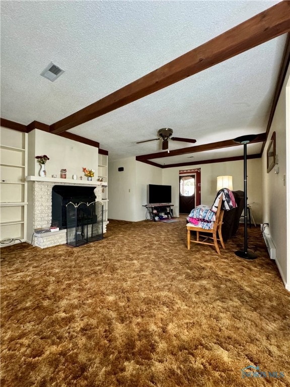 living room featuring beam ceiling, a textured ceiling, carpet floors, and ceiling fan