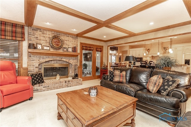 carpeted living room with beamed ceiling, a brick fireplace, coffered ceiling, and crown molding