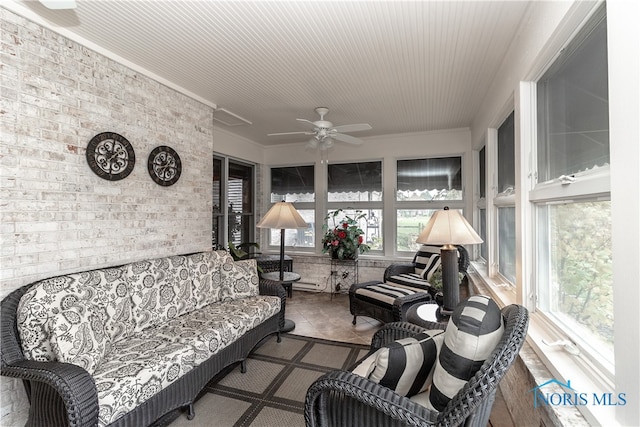 sunroom featuring ceiling fan