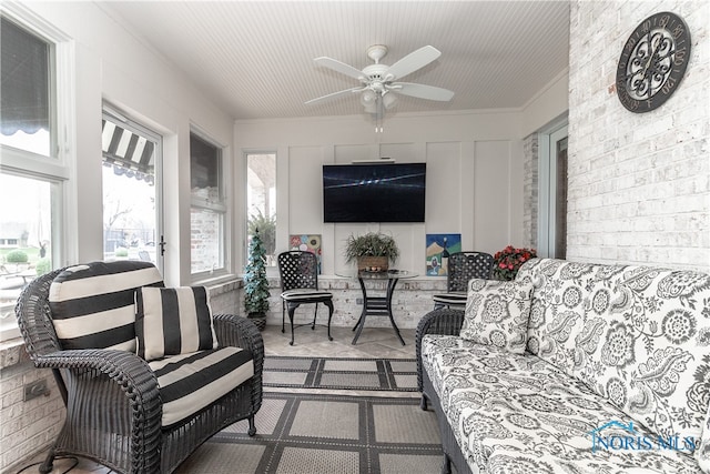 sunroom / solarium with ceiling fan