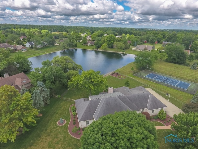 birds eye view of property with a water view