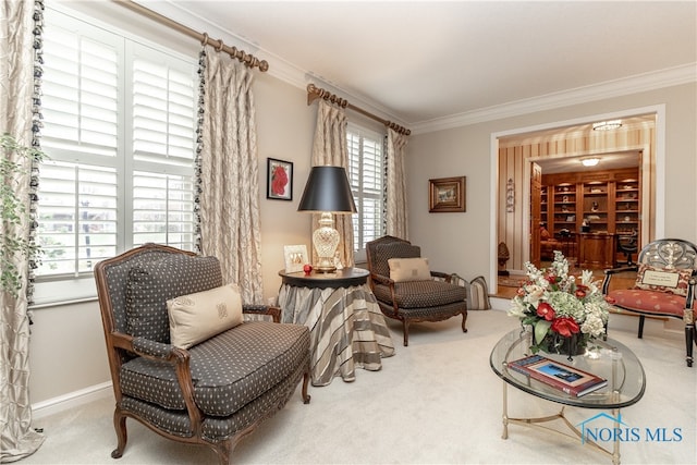 sitting room featuring carpet and ornamental molding