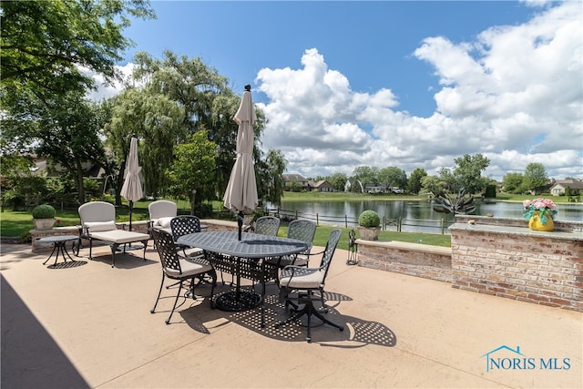 view of patio featuring a water view