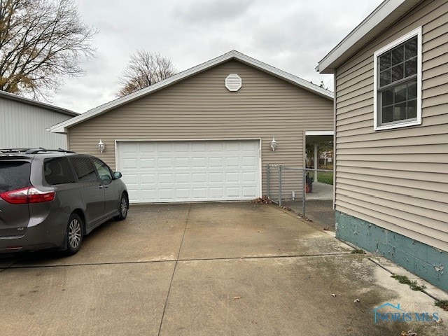 view of side of home featuring a garage