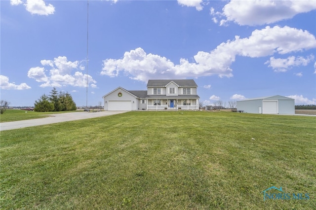 view of front facade with a garage, covered porch, and a front yard