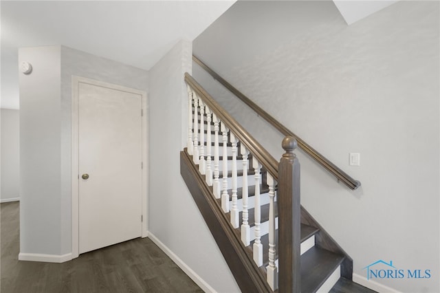 stairway featuring hardwood / wood-style flooring