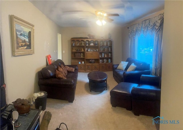 living room with carpet and ceiling fan