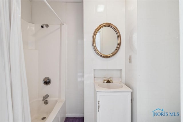 bathroom with vanity and  shower combination