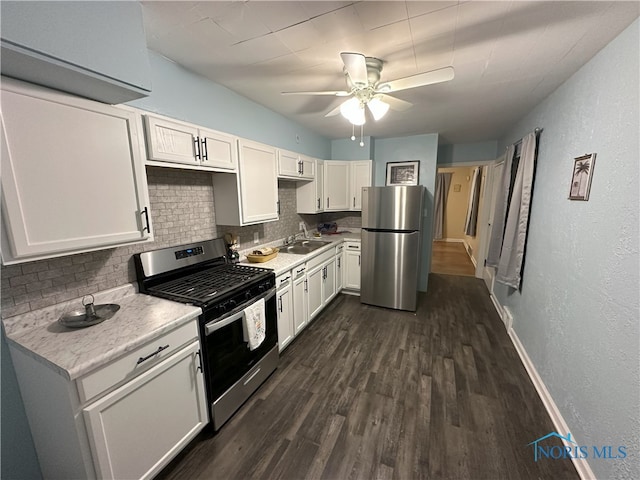 kitchen with tasteful backsplash, dark wood-type flooring, white cabinets, and stainless steel appliances