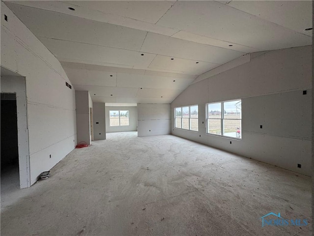 empty room with lofted ceiling