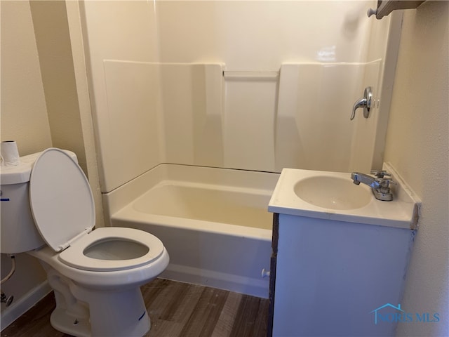 bathroom with vanity, hardwood / wood-style flooring, and toilet