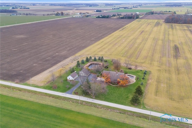 birds eye view of property with a rural view