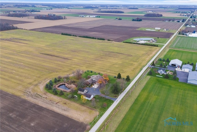 birds eye view of property with a rural view