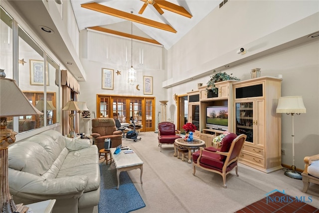 carpeted living room featuring beamed ceiling, ceiling fan, high vaulted ceiling, and french doors