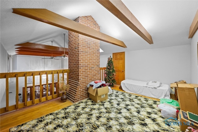 bedroom with hardwood / wood-style floors and lofted ceiling with beams