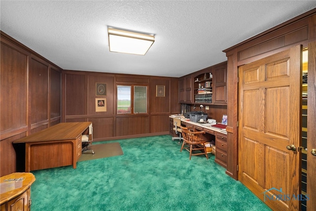 office area featuring a textured ceiling and dark carpet