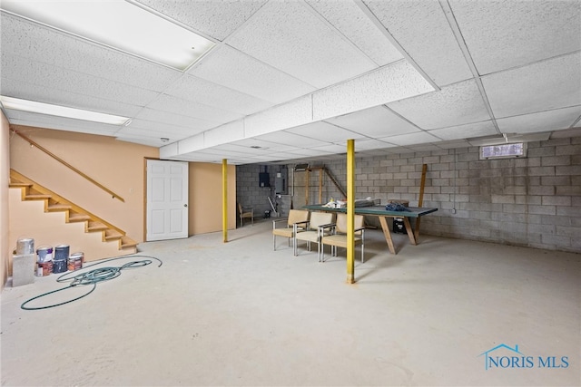 basement featuring a drop ceiling