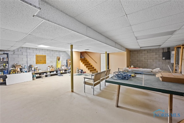 basement with a paneled ceiling