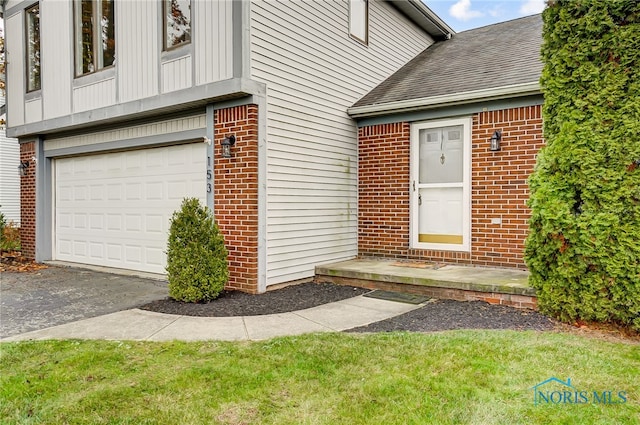 entrance to property featuring a garage