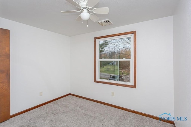 carpeted empty room with ceiling fan