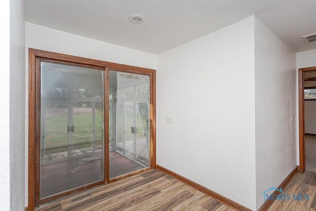 doorway featuring wood-type flooring