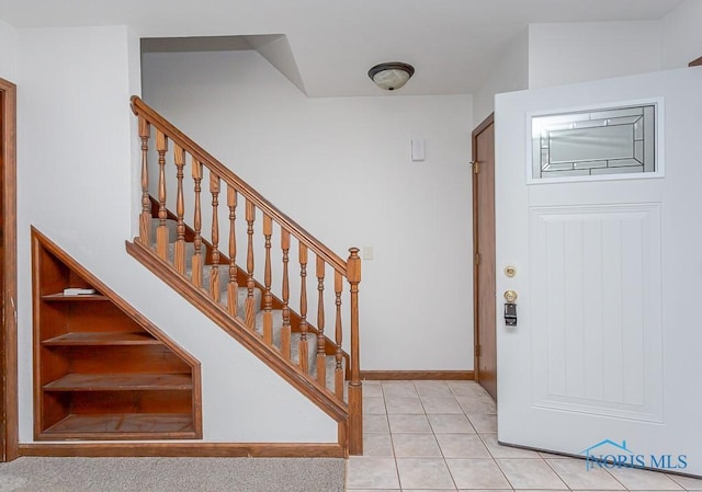 foyer with light tile patterned floors