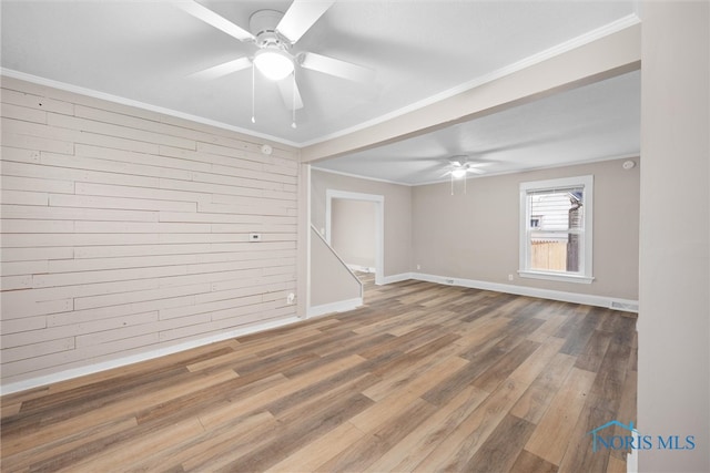 spare room with ceiling fan, hardwood / wood-style floors, and ornamental molding