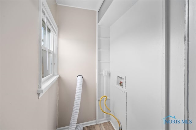 washroom featuring washer hookup and wood-type flooring