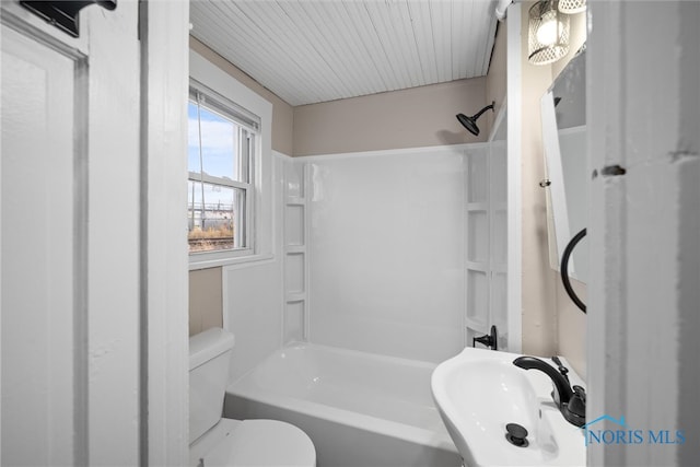 full bathroom with toilet, tub / shower combination, and sink