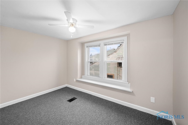 unfurnished room with ceiling fan and carpet floors