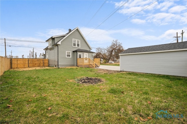 rear view of property featuring a yard