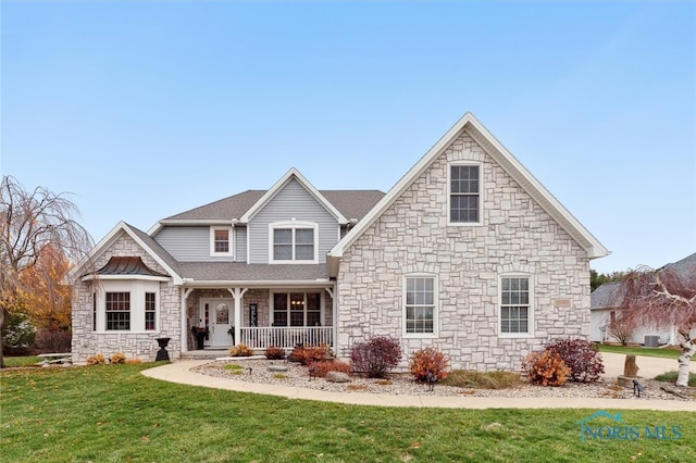 view of front facade with a front lawn and a porch