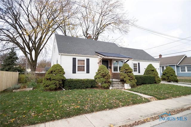 view of front of property with a front lawn