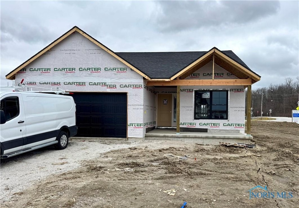 property in mid-construction with a garage