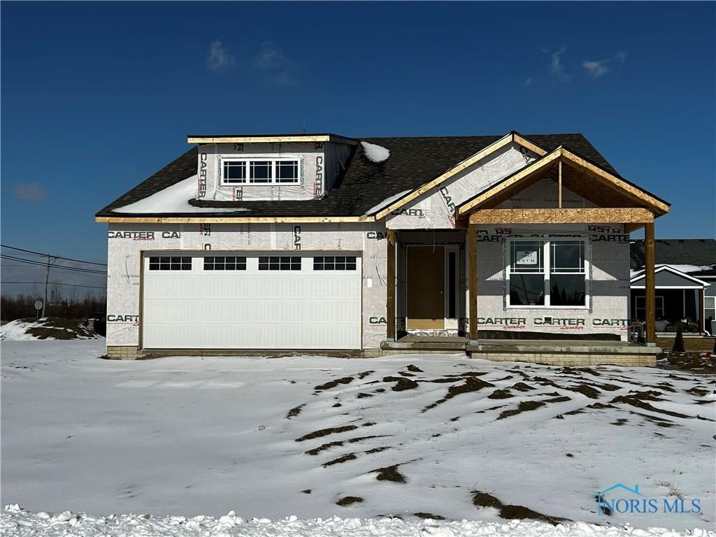 unfinished property with a garage