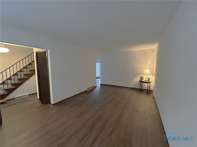 unfurnished living room with hardwood / wood-style flooring