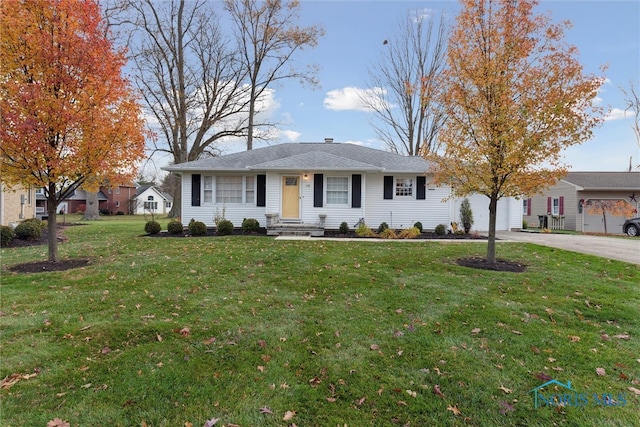 ranch-style house with a front lawn