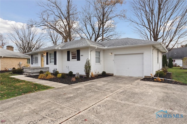 single story home featuring a garage