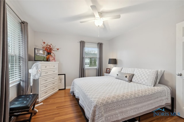 bedroom featuring ceiling fan and light hardwood / wood-style flooring