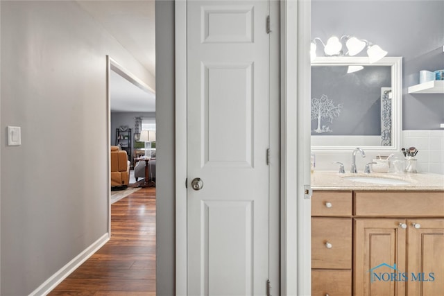 bathroom featuring hardwood / wood-style floors and vanity