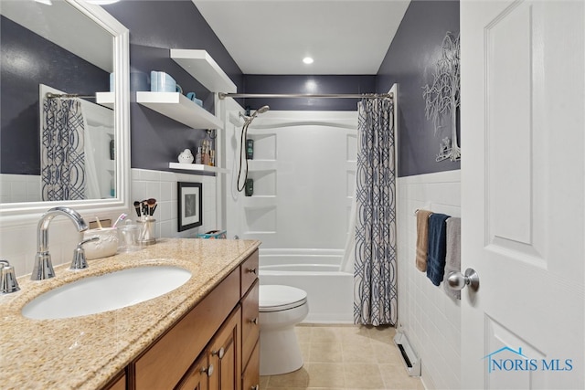 full bathroom with tile patterned flooring, toilet, baseboard heating, tile walls, and shower / tub combo with curtain