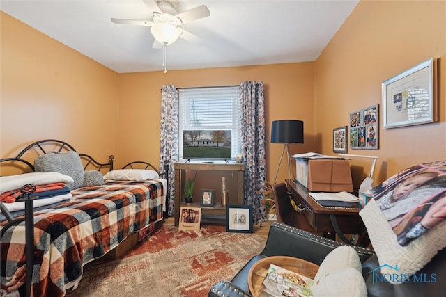 carpeted bedroom featuring ceiling fan