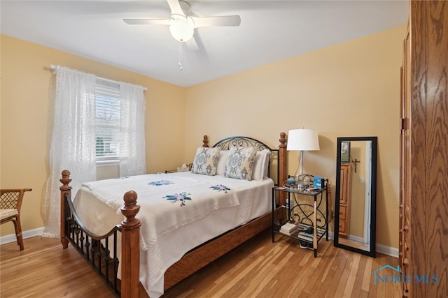 bedroom featuring light hardwood / wood-style flooring and ceiling fan