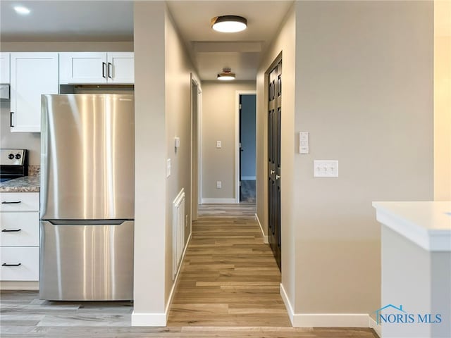 hallway featuring light hardwood / wood-style flooring