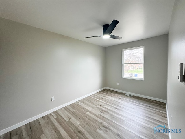 unfurnished room with ceiling fan and light hardwood / wood-style floors