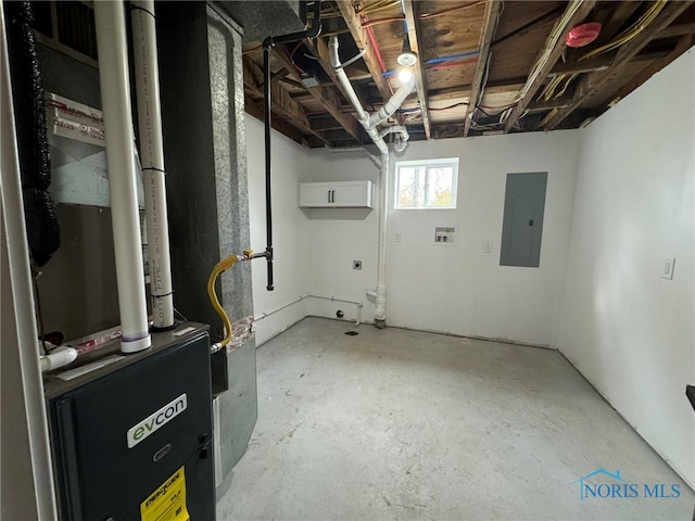 basement featuring electric panel and heating unit