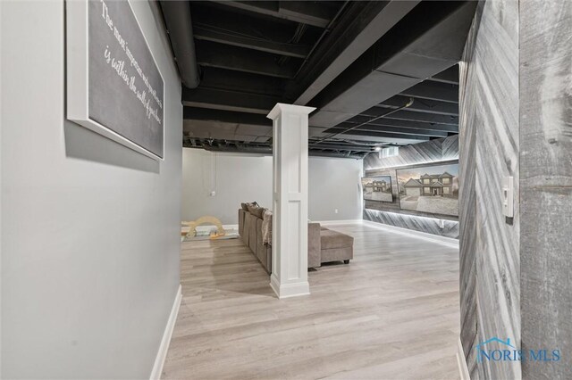 basement featuring light wood-type flooring