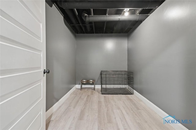 laundry area featuring light hardwood / wood-style flooring