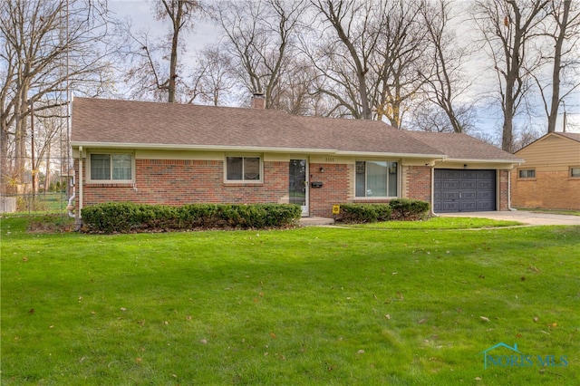 ranch-style home with a garage and a front lawn