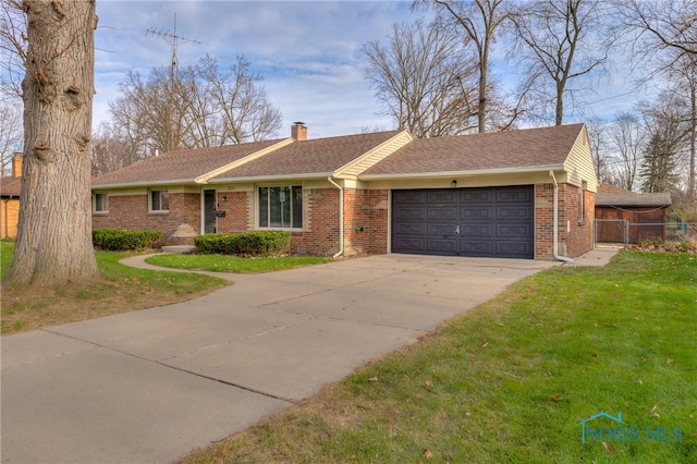 ranch-style home with a garage and a front yard